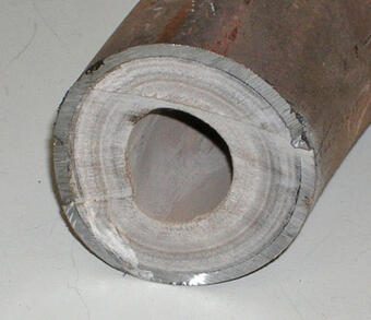 Hardness in water: Lime scale buildup inside a water pipe